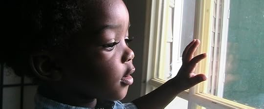 child-with-hand-on-window