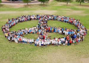 Seven hundred students at Kyrene de las Brisas Elementary School celebrated 100 days of peace—no students sent to the office, no arguments, no conflicts—by having a parade through the school, then heading outside for a peace-symbol photo and final cool-down with frosty Otter Pops. It was a great day for the students, teachers and administration, who dressed for the occasion in “peace” wear, school colors of purple and turquoise and gear symbolizing the school mascot, a gecko.