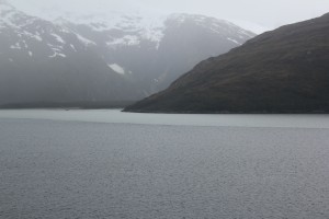 The apron of light blue around the promontory is not a trick of light; it's the fresh water of the melting glacier meeting the salt water of the channel.