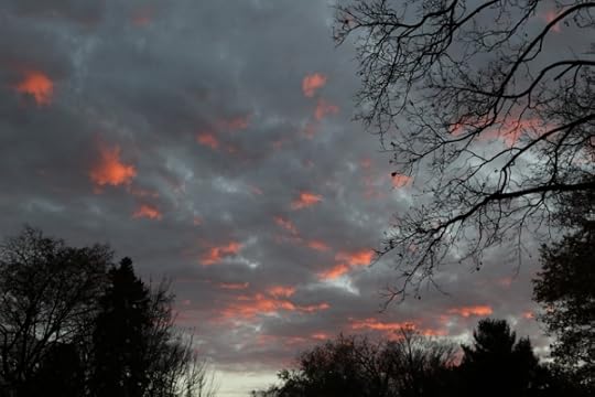 Red patches of cloud at sunset.