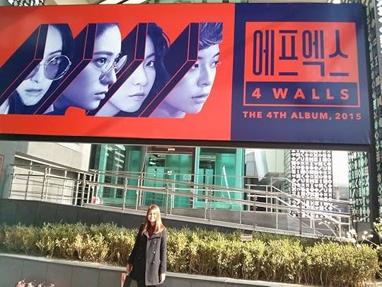 A huge f(x) banner welcomes you to COEX and to the SMTown Artium.