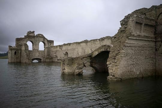 The remains of a mid-16th century church known as the Temple of Santiago, as well as the Temple of Quechula, is visible from the surface of the Grijalva River, which feeds the Nezahualcoyotl reservoir, due to the lack of rain near the town of Nueva Quechula, in Chiapas state, Mexico, Friday, Oct. 16, 2015. The church was abandoned due the big plagues of 1773-1776, said architect Carlos Navarette, who worked with Mexican authorities on a report about the structure that would be flooded in 1966 when the dam was completed. (AP Photo/David von Blohn)