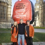 Andy Worthington and Joanne MacInnes of We Stand With Shaker with music legend Roger Waters (ex-Pink Floyd) at the launch of the campaign outside the Houses of Parliament on November 24, 2014 (Photo: Stefano Massimo).