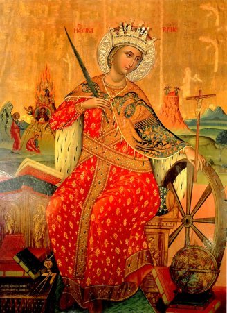 An icon of St. Catherine, with her wheel. Note the 2 images of Mt. Sinai in the background: Moses at the burning bush on the left and the later fortress-monastery on the right.