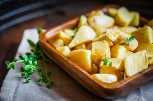 Baked potatoes on wooden background