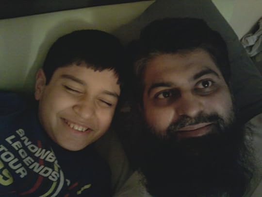 Humza, now age 11, with his 'superhero' dad, Amir