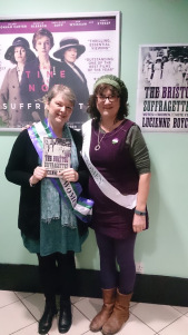 Lucienne Boyce and Debbie Young wearing the official colours of the Suffragettes 