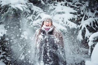 Winnter girl and snow fir tree.