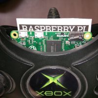 The Raspberry Pi Zero is small enough to fit inside of the original Xbox controller and is connected via a modified USB OTG cable.