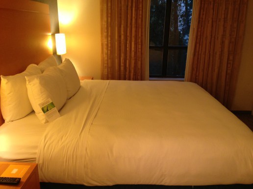 View of the bed, from the bathroom