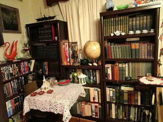 Here are the shelves in the light. Do you see the Magic and Circus Books? Those things are so heavy, you could literally use them as murder weapons. Yes, I know, not very Holiday-post like. Sorry. :-/