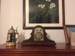 The entire bookcase, including the clock.