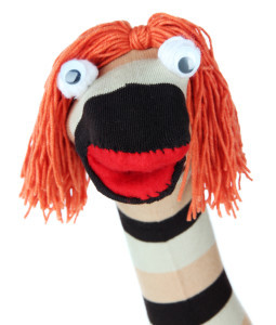 Cute sock puppet isolated on white