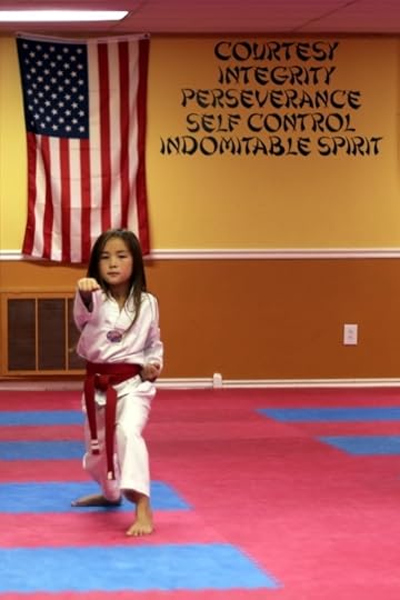 SteelyKid doing punches at her belt test.
