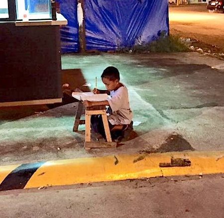 Boy-studying-on-street-Facebook