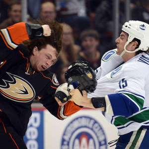 Matt Beleskey #39 of the Anaheim Ducks fights Aaron Volpatti #15 of the Vancouver Canucks