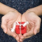 Woman holding miniature gift
