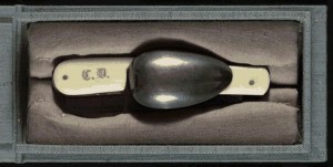 The traveling cutlery kit owned by Charles Dickens, marked with his initials and used by him during his travels to the United States in the 1860s. Steel spoon, knife and corkscrew unfold from ivory-covered case. Rare Book and Special Collections Division. 