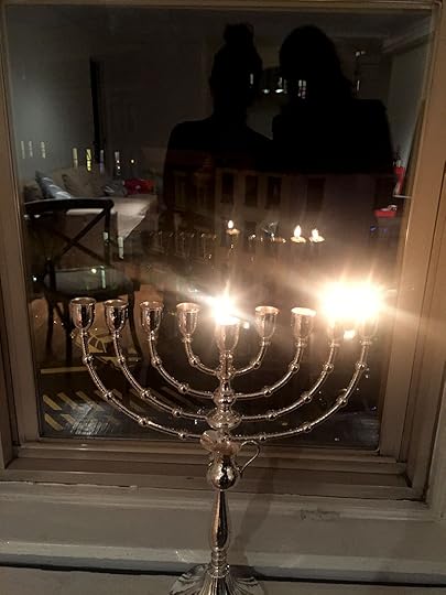 amelia-diamond-man-repeller-lighting-menorah-window