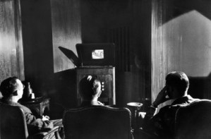 Radio Corporation of America (RCA) executives watching brand new invention called television, or TV, in corp. offices before introducing the product to the public.
