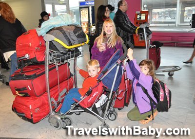 Family and suitcases at Paris CDG
