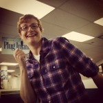 In the airport, super happy. A friend notes that my joy seems to be about the USB cable in the background.