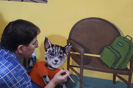Painting whiskers on the cat