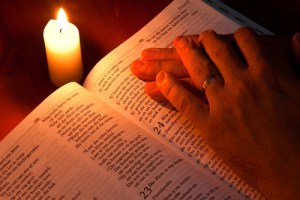 Bible by candle light