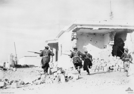 Australian troops rushing through the streets of Bardia, Libya, 4 Jan 1941 (Australian War Memorial)