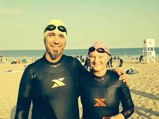Mary and the JBE with our wetsuits, prior to a summer tri.