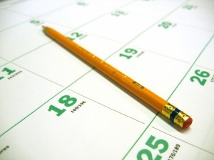 Partial image of calendar page, with a pencil on it.