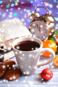 Composition of book with cup of coffee and Christmas