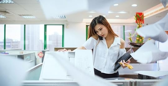 Woman busy and stressed at office