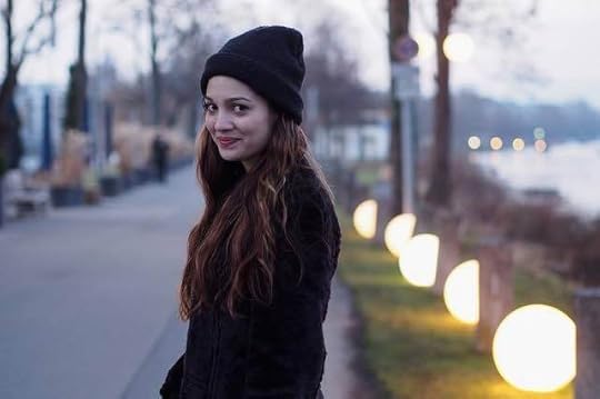 woman-smile-beanie-sidewalk
