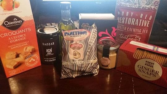From left to right: orange peel cookies, dessert sauce, olive oil, sweet loaf, chocolate truffles, hazelnut cream, tea, and ginger snaps (duh).