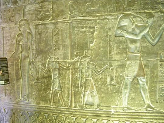 Figure 2. An image of the Weighing of the Heart theme from a Ptolemaic Tomb, Deir el Medinah, Egypt. From left to right are the neters/gods Maat, Horus, Anubis and Djeuti/Thoth.