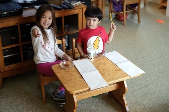 The kids manning their sign-in desk.