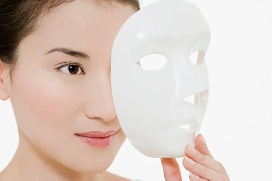 Woman removing mask