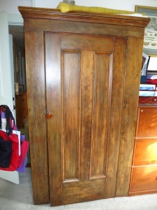 19th C wardrobe re-purposed for office supplies (Blankets for cat on top!)
