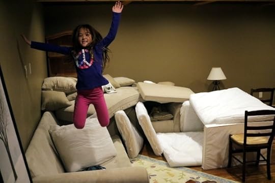 SteelyKid is really happy to be making a pillow fort.