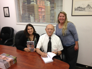 Joe with April and Valerie at private book signing
