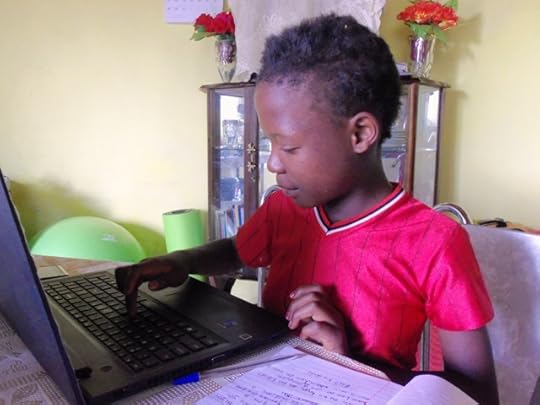 Teaching Karabelo how to use my laptop