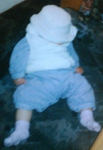 Baby Laura asleep in winter fur hat