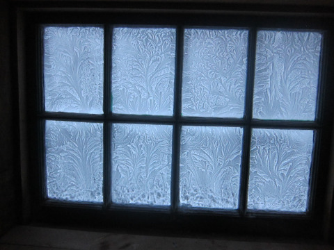 Morning ice on inside of barn windows