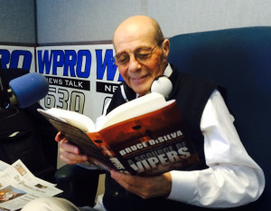 Buddy Cianci reading one of my crime novels, 