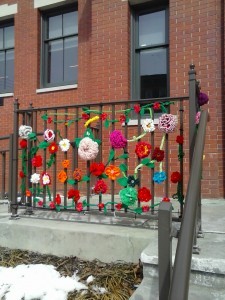 Fiber art flowers decorate a railing at CLP-South.