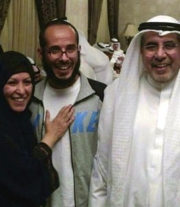 In this photo released by the al-Odah family, Fawzi al-Odah is shown with an unidentified relative on the left and his father Khalid on the right on his arrival in Kuwait on November 6, 2014.