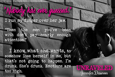 guy kissing his girlfriend against a wall at home