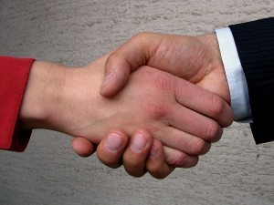 Photo of two people shaking hands
