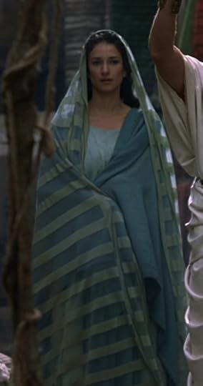 Niobe is wearing a stola of two different shades of blue, and a long cape thing over her head like the virgin mary or something.